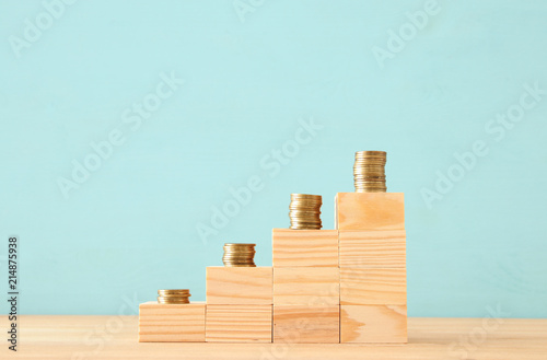 concept image of Saving money or investing. putting stack of coins at the top.