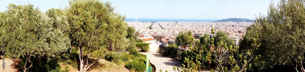 Beautiful panorama to the city of Barcelona and the sea from the observation platform in the Park Guël Beautiful panorama to the city of Barcelona and the sea from the observation platform in the Park Guël