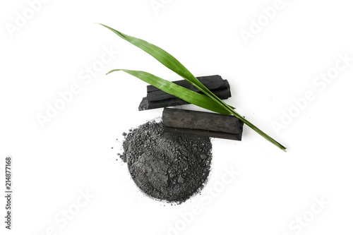 Activated charcoal powder on white background photo