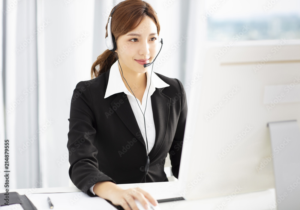 beautiful young business woman operator in headset