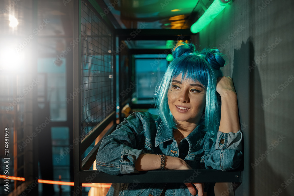 Portrait of young beautiful pop woman wearing a blue wig Portrait of young beautiful pop woman wearing a blue wig