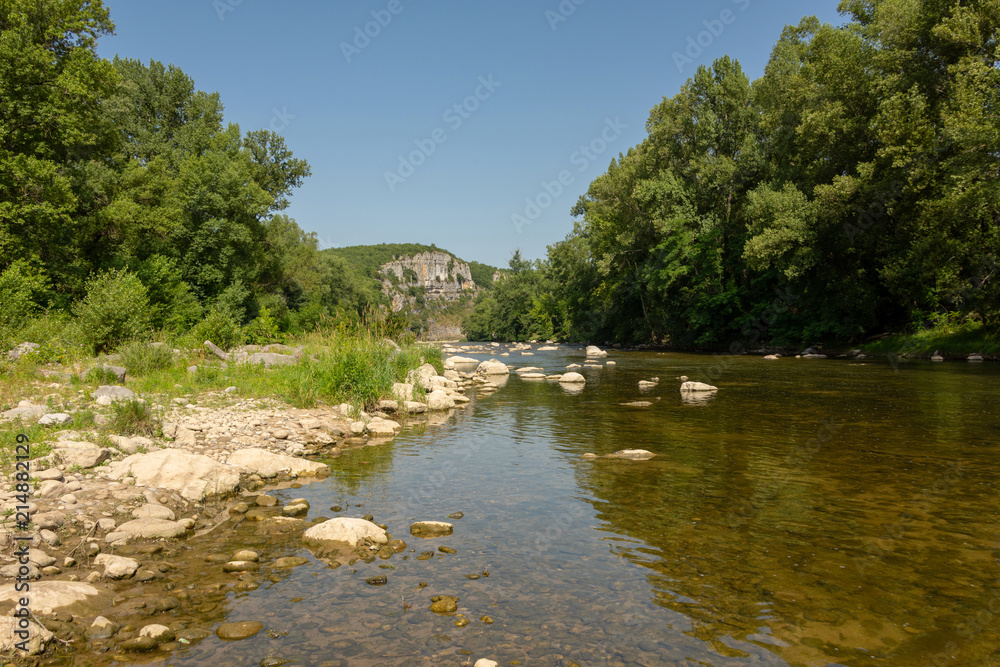 View of the river Ardeche with its stony shore near the small village Chauzon in the south of France View of the river Ardeche with its stony shore near the small village Chauzon in the south of France