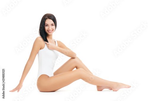 Fit and sporty girl in white swimsuit. Sport, fitness, diet, weight loss and healthcare concept.