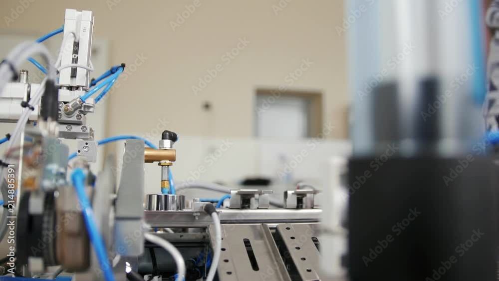 Automated mechanical machine - mini factory at working process Automated mechanical machine - mini factory at working process