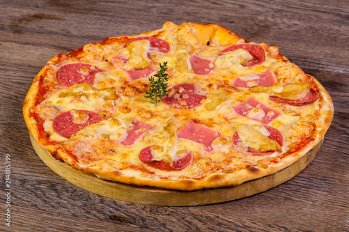 Pizza with ham and sausages