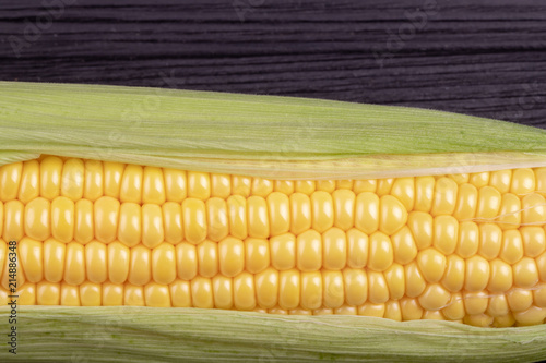 cob  corn on a black wooden background