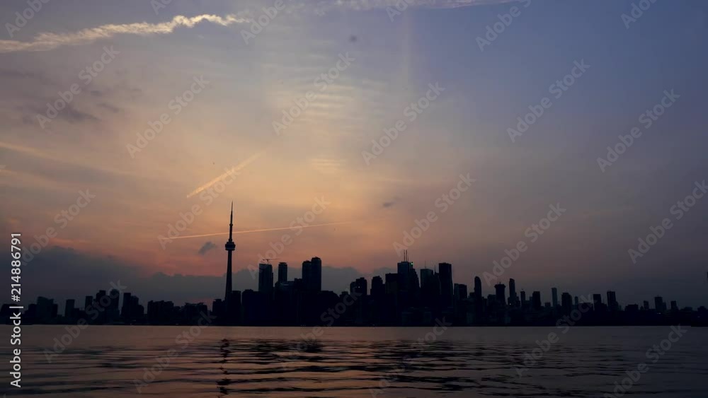 Short timelapse of the Toronto skyline from the island across during the sunset Short timelapse of the Toronto skyline from the island across during the sunset