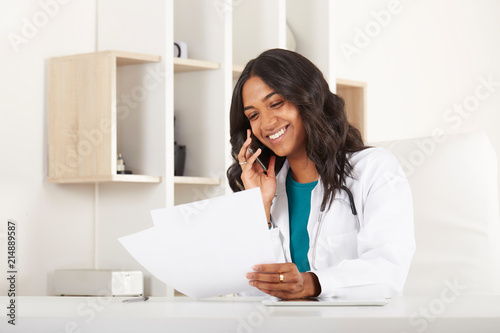 pretty female doctor working in her studio