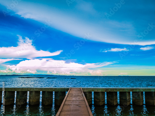 Wooden bridges on the ocean with idyllic ocean and beautiful Sky in vacation time Holiday in the sea Summer concept