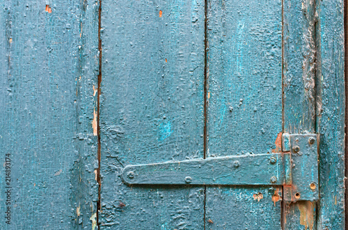 door hinge on old painted door, background texture