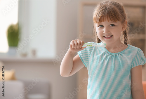 Cute little girl with tooth...