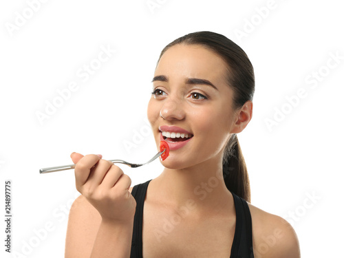 Young sporty woman eating f...