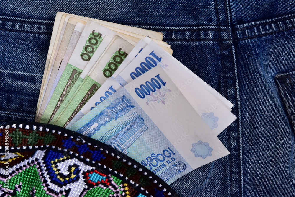 Obraz premium Uzbek national money in a nice clutch purse