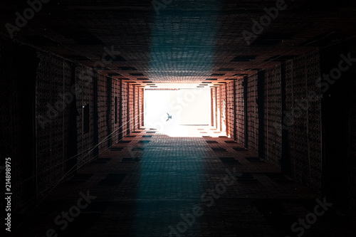 A vertical hole in the middle of a building