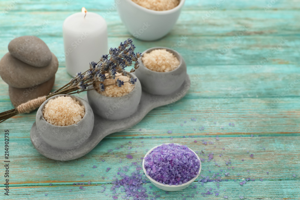 Spa composition with beautiful lavender and sea salt on wooden table
