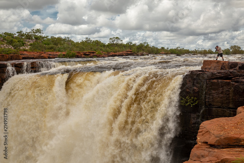 Photographer at the top of the Easternmost Falls in flood on the King George River, Kimberley, Western Australia photo