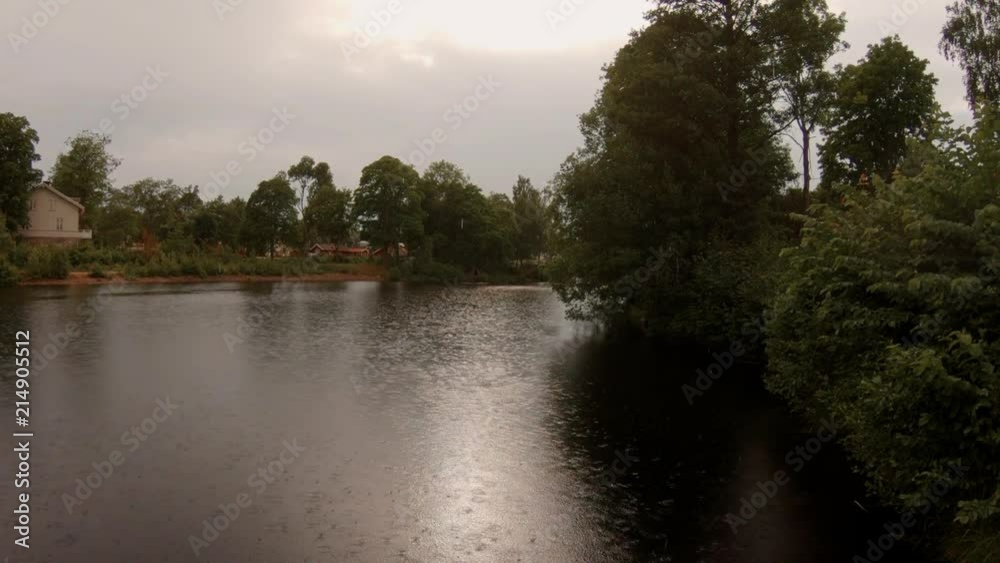 A tranquil canal i Fagersta Sweden during a light summer rain A tranquil canal i Fagersta Sweden during a light summer rain