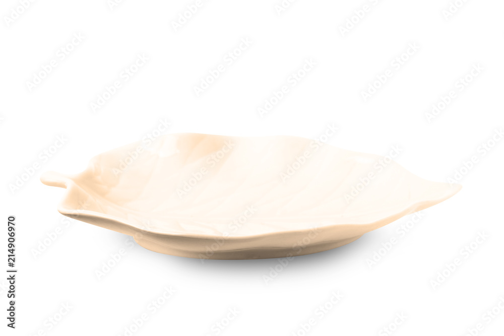 Brown leaf shape plate isolated on white background.