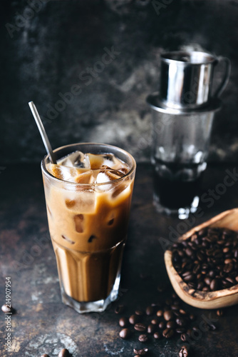 Traditional Vietnamese milk coffee on rustic background