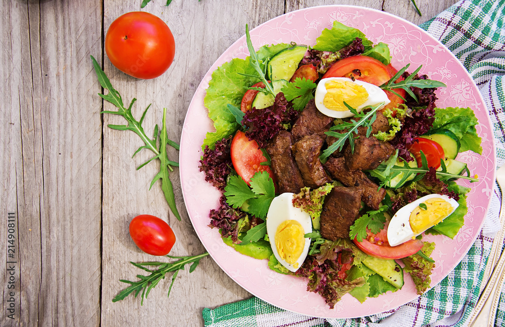 Meat salad with liver and fresh vegetables. Top view, Flat lay