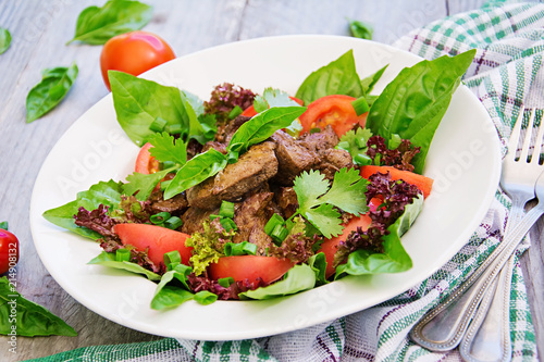 Meat salad with liver and fresh vegetables.