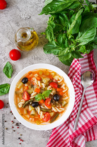 Minestrone, italian vegetable soup with pasta. Vegan food. Top view. Flat lay.