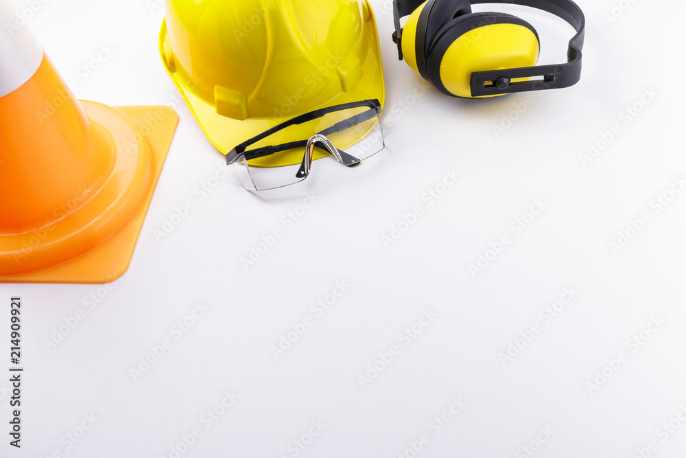 Construction Safety Gear and Traffic Cone on White Background Copy Space