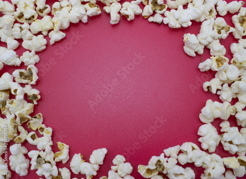 Popcorn. Food concept. Empty space for text and design. Red background