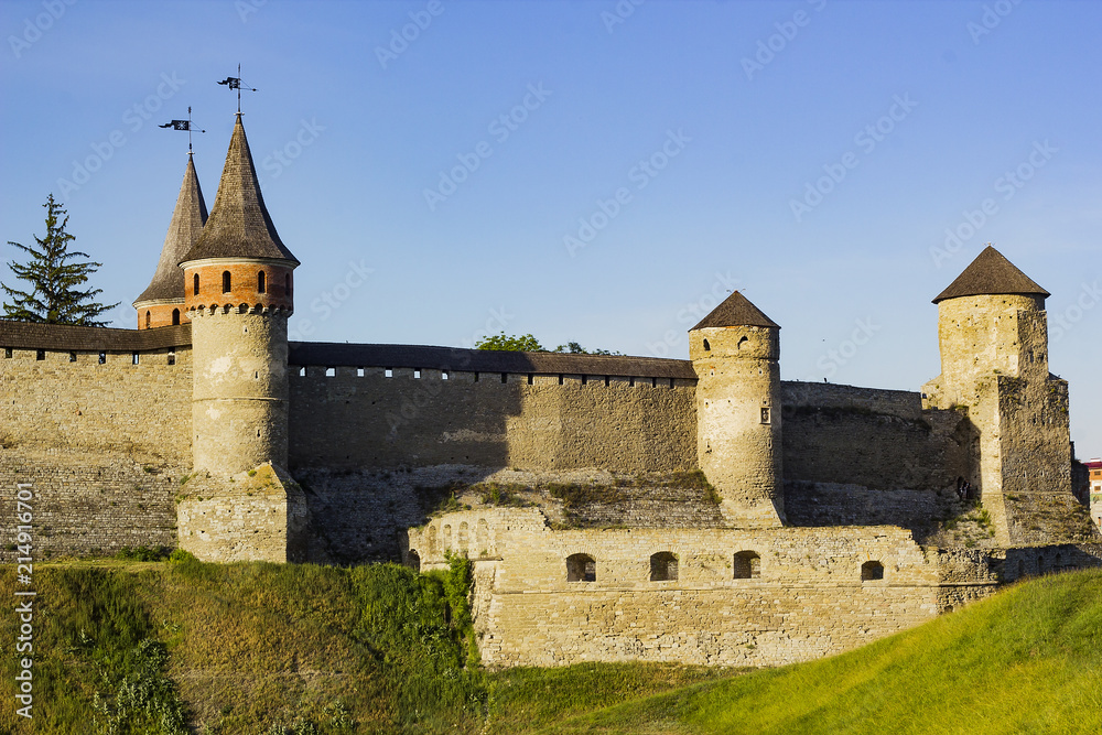 Part of Fortress against blue sky, Kamianets-Podilskyi
