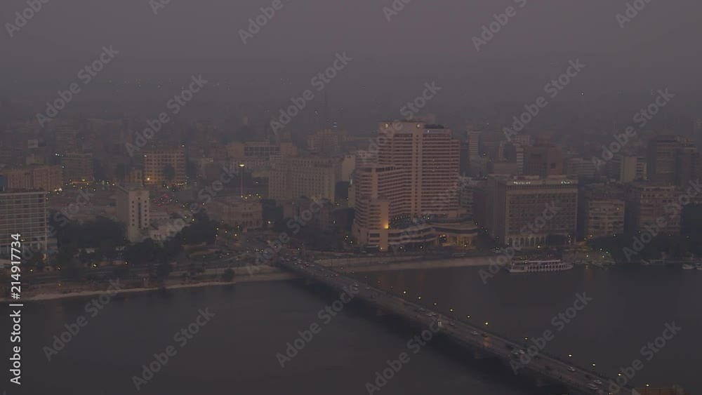 Busy street next to the Nile River in Cairo Egypt during Sunset magic hour. Busy street next to the Nile River in Cairo Egypt during Sunset magic hour.