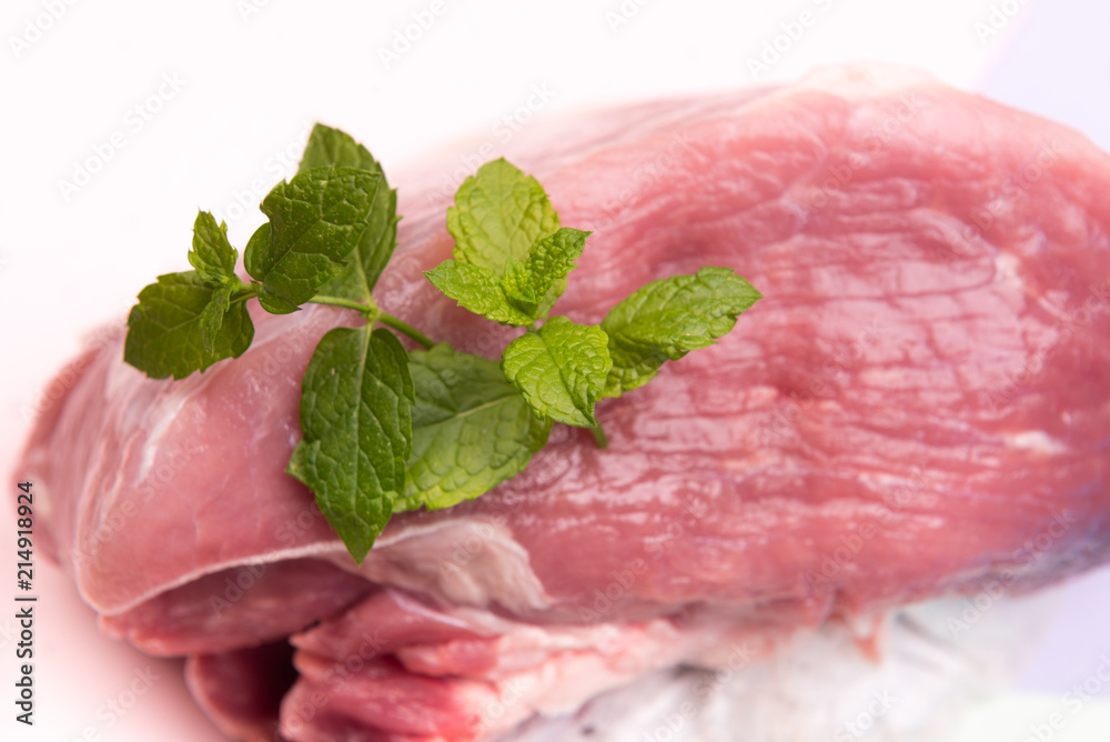 raw meat on colorful backgrounds with vegetables raw meat on colorful backgrounds with vegetables