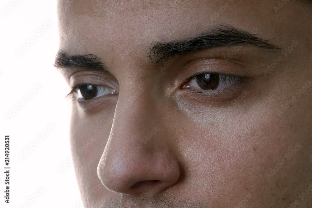 Fototapeta premium closeup of male eyes, isolated on white