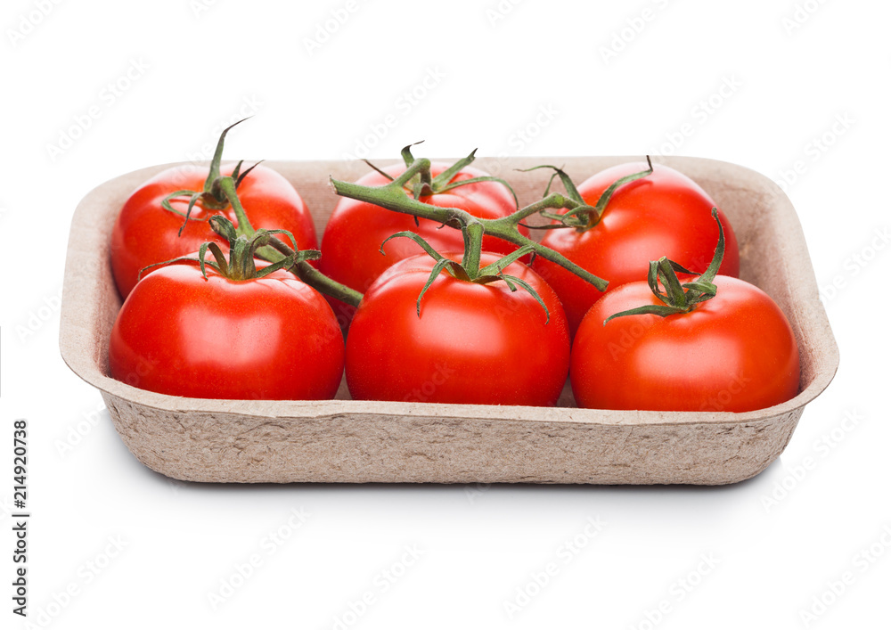 Tray with fresh raw organic tomatoes on white Tray with fresh raw organic tomatoes on white