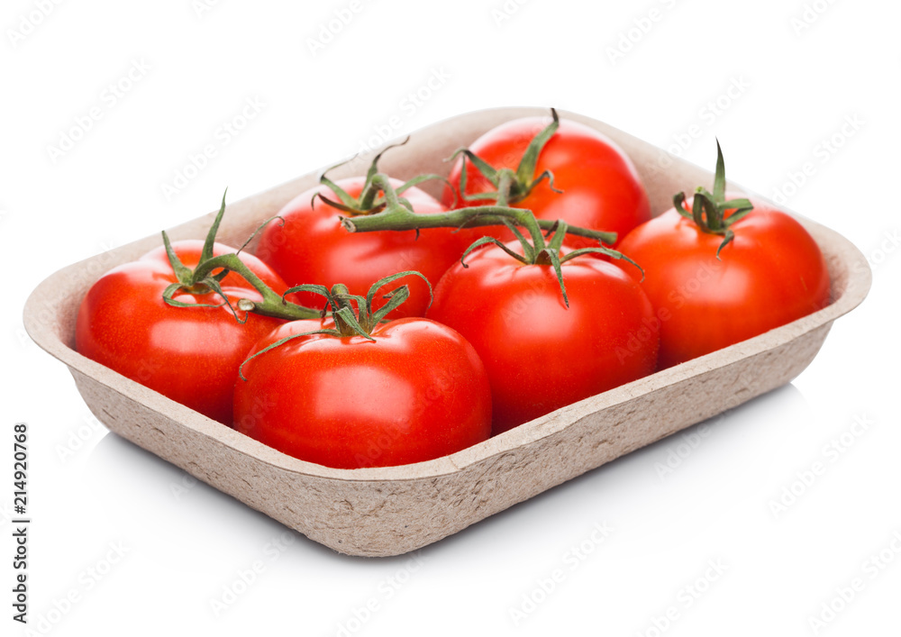 Tray with fresh raw organic tomatoes on white Tray with fresh raw organic tomatoes on white