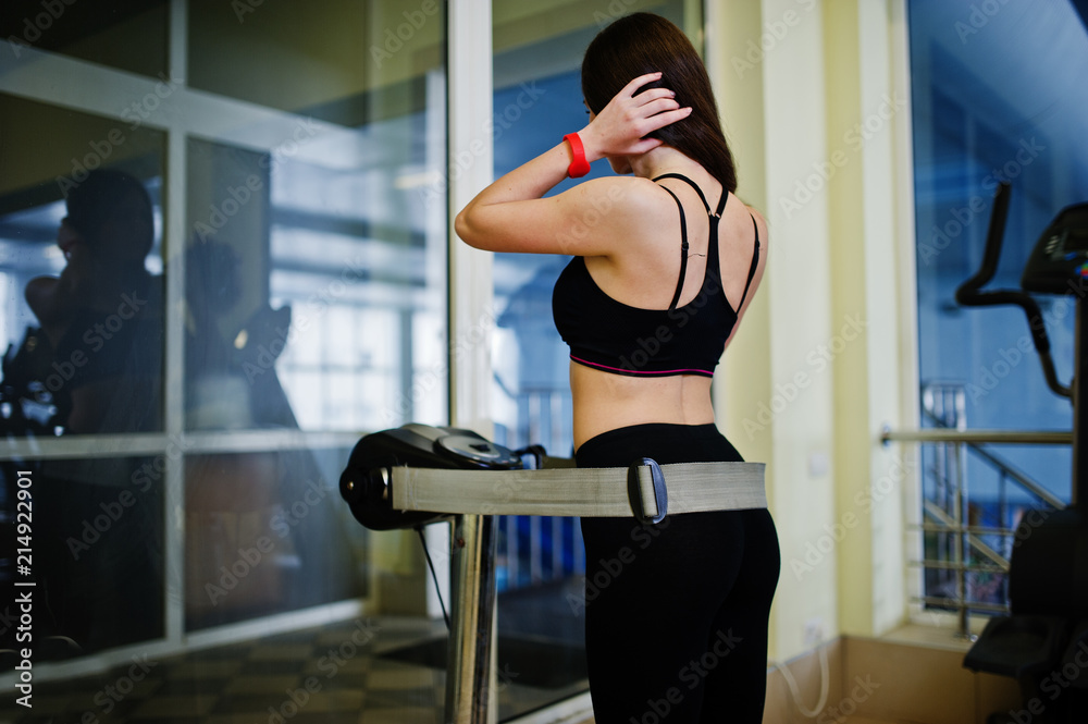 Young sport girl workout in gym. Fitness woman doing exercises. Sexy ass at anticellulite massager simulator. Young sport girl workout in gym. Fitness woman doing exercises. Sexy ass at anticellulite massager simulator.