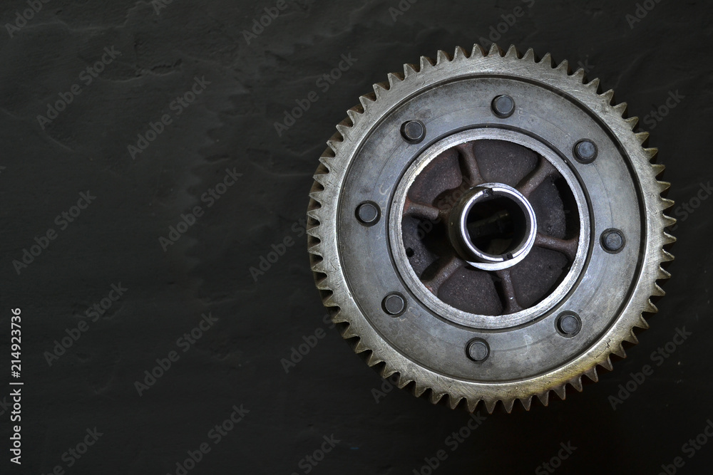 Gear on a black background. Free space for text. Gear on a black background. Free space for text.