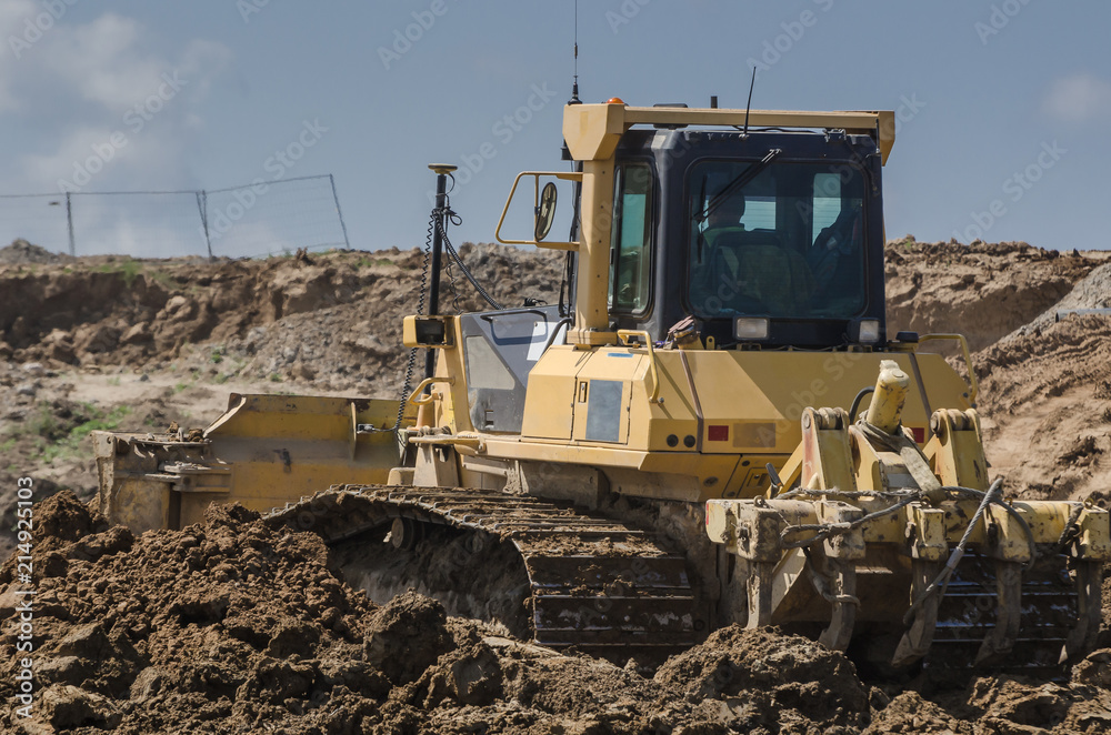 BULLDOZER - Machine on the express road construction site BULLDOZER - Machine on the express road construction site
