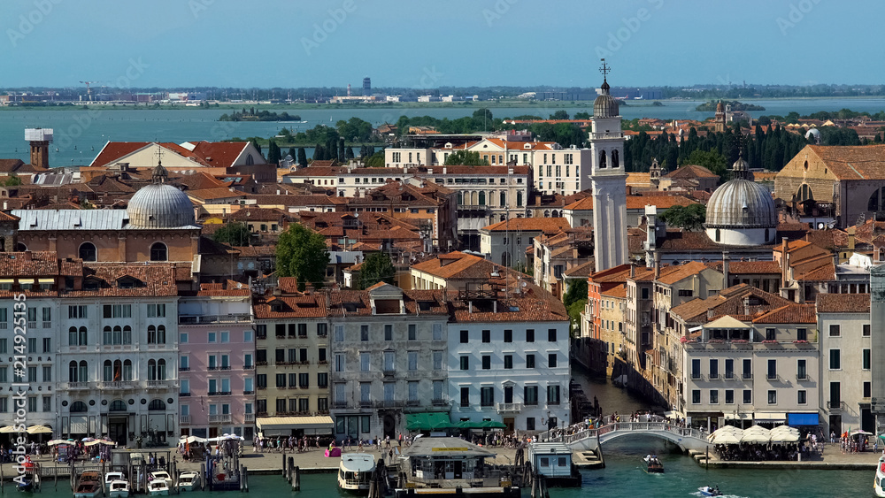 Antique architecture of Venice, view of buildings and tourists walking on bridge