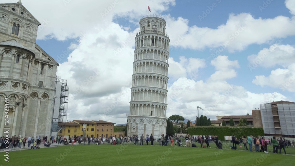 People enjoying view of Leaning Pisa Tower and ancient basilica, exciting tour