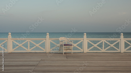 one chair on sea coast  concept of resort