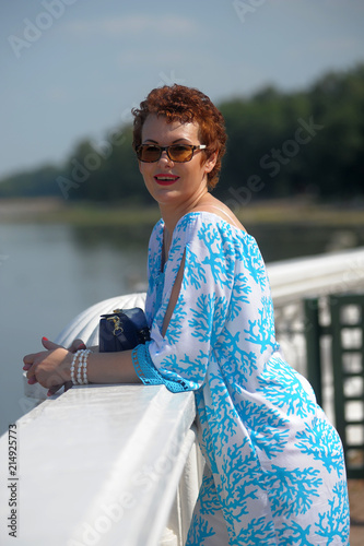 happy woman with short hair in sunglasses photo