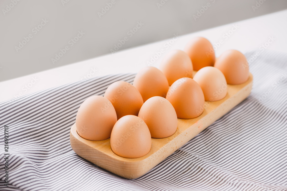 Eggs in a wooden tray ready cooking