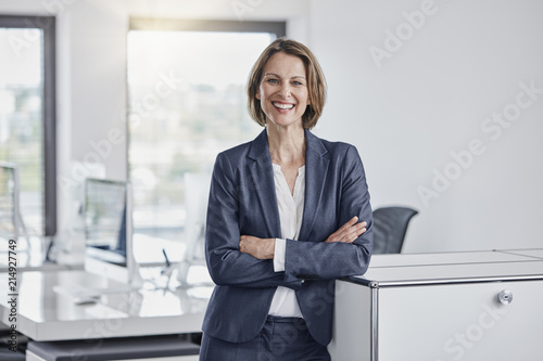 Portrait of happy businesswoman in office photo