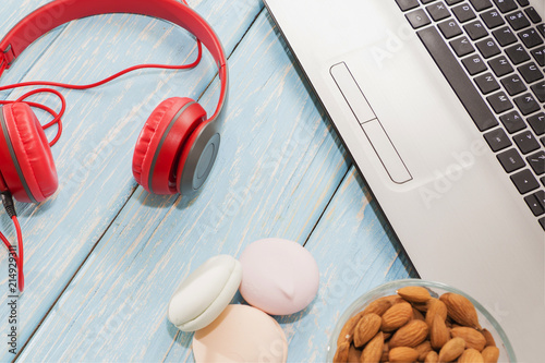 open laptop with, marshmallows and red headphones. photo