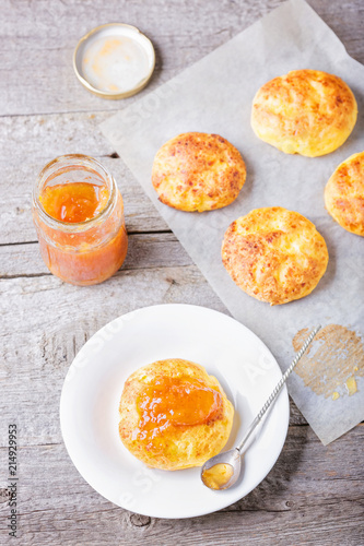 Cottage cheese pancakes baked in the oven. Russian dessert syrniki with jam. 