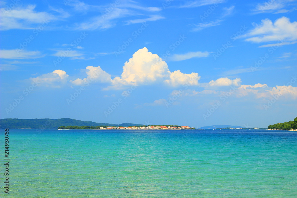 Island Krapanj near Sibenik touristic destination, panoramic view, clear blue sea and sky with clouds Island Krapanj near Sibenik touristic destination, panoramic view, clear blue sea and sky with clouds