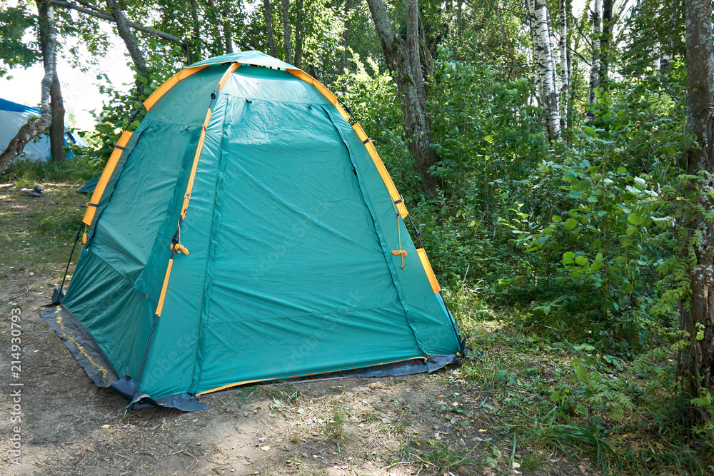 Tourist camping tent in forest