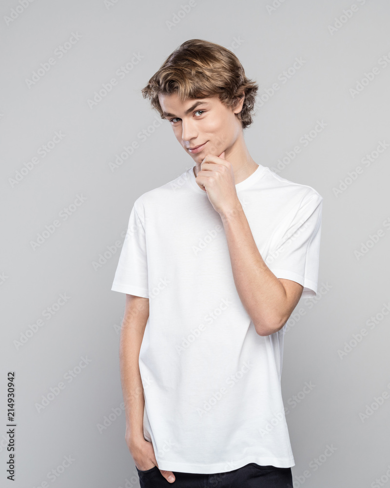 Portrait of cute young man in white t-shirt Portrait of cute young man in white t-shirt