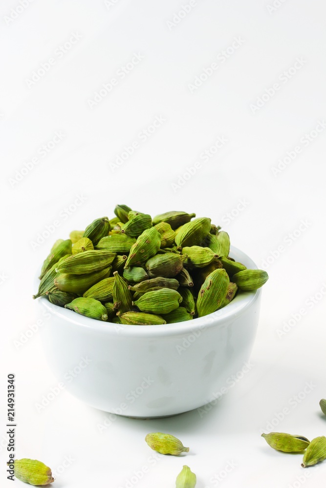 Fresh Green Cardamom isolated on white, selective focus Fresh Green Cardamom isolated on white, selective focus