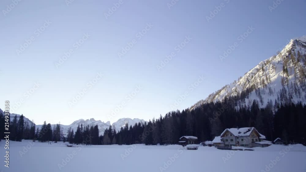 Tilt down shot of mountain loidge in winter with snow Tilt down shot of mountain loidge in winter with snow